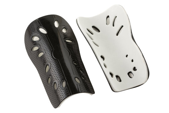 black plastic leg protector, for playing football, on a white background, isolate