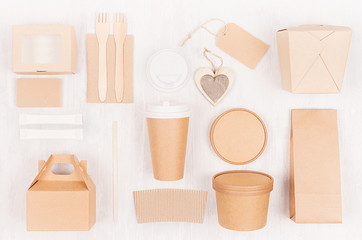 Mockup food takeaway packaging for cafe and restaurant - heart, cardboard boxes for coffee, burger, noodles, sandwich, sushi on light white wood table.