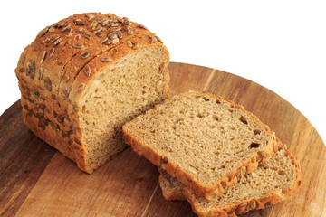 Rye bread on a white background. Rye bread with sunflower seeds. Close-up.