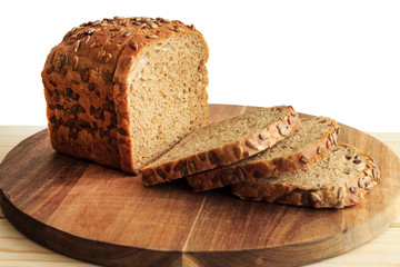 Rye bread on a white background. Rye bread with sunflower seeds. Close-up.