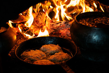Food cooked on stove fire, potato pancakes, European country food.