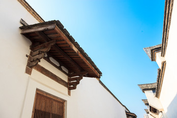 Fototapeta na wymiar Two row of The traditional Chinese roof and wall against a blue sky. Old houses in the Three Lanes and Seven Alleys, most famous place in Fuzhou,Fujian,China