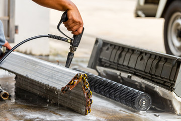 Close up of Repairman washing dirty inside compartments air conditioner, Technical team clean mold...