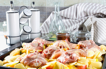 Delicious raw chicken with fresh vegetables, fruits and spices