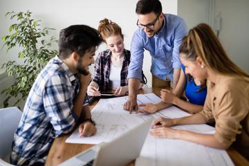 Portrait of architects having discussion in office