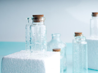 Few transparent bottles, water sprays. empty glass bottles.