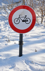No cycling traffic sign in the snow winter time