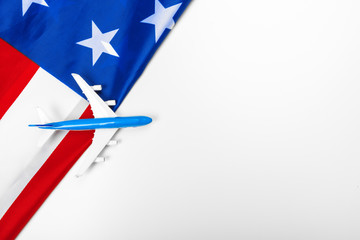 Plastic toy jet plane and flag of USA.