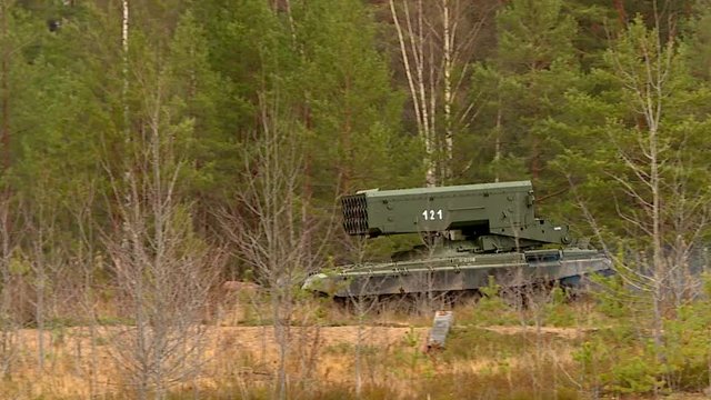 Military exercises in the open area with the use of armored vehicles, tanks and assault forces.