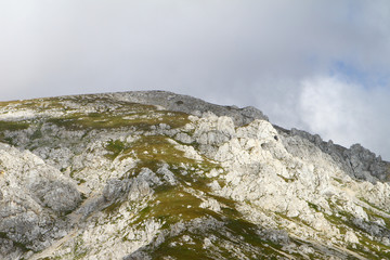 nice mountain cliff with blue sky, natural landscape photo