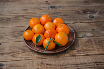 a ripe tasty tangerines on a plate