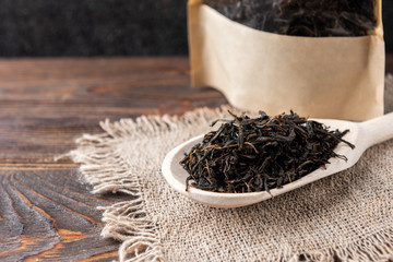 Dried Ivan tea on wooden background.