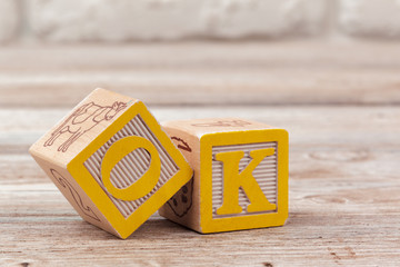 Wooden toy Blocks with the text: ok