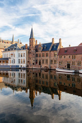 Fototapeta na wymiar Rozenhoedkaai canal (Quai of the Rosary), and Belfort van Brugge’s Belfry Tower. Typical view of Bruges (Brugge), Belgium.