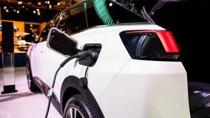 Obraz na płótnie Canvas electric car plug charging