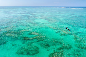 Fototapeta na wymiar alone blue sail boat in lagoon on Zanzibar island