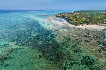 Low tide in lagoon and view to lighthouse on Zanzibar