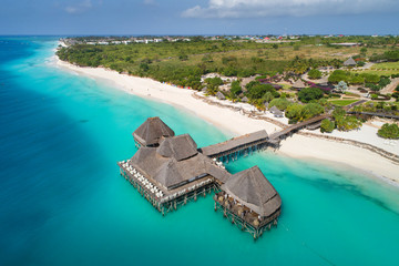 aerial view to blue lagoon and wooden restaurant on Zanzibar