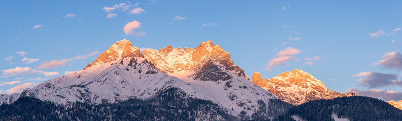 Idyllic snowy mountain peaks, setting sun in winter, landscape, Alps, Austria