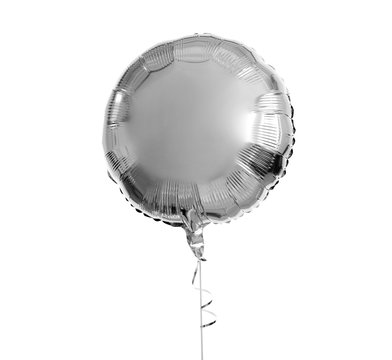 holidays, birthday party and decoration concept - one metallic silver inflated helium balloon over white background
