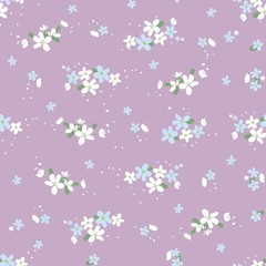 Seamless floral pattern with small cute flowers on a light violet background. light floral texture.