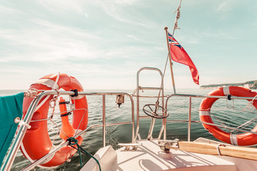 United Kingdom flag and lifebuoy on sailing boat