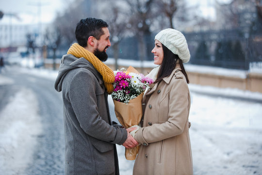 Cuple hold hands and flower