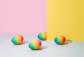 Painted eggs on pastel background.