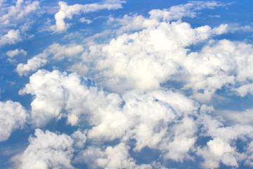 Naklejka na ściany i meble Beautiful of blue sky and white cloud looks from the window of the plane.
