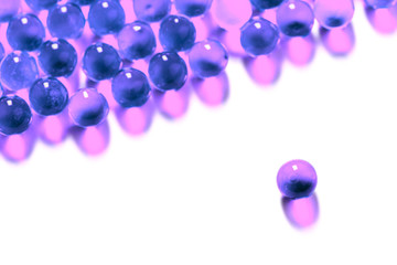 proton purple spherical ball capsules with selective focus isolated on white background