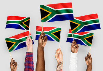 Hands waving flags of South Africa