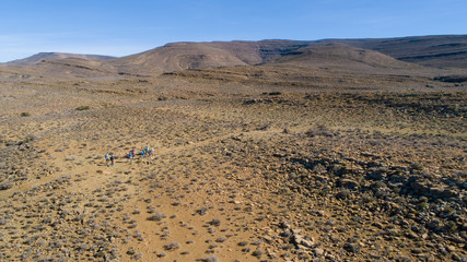 Aerial image of a group of hikers doing a hiking train in the karoo region of south africa