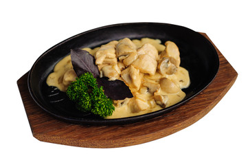 Roasted mushrooms with sauce in cast iron pan