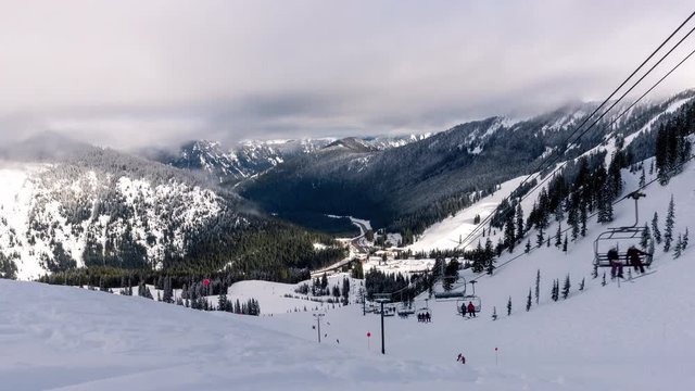 Winter Ski and Snowboard Resort Chairlift Timelapse Zoom Out