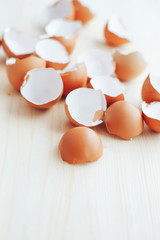 Brown eggshell on wooden background