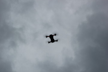 Dron on dark and grey day.