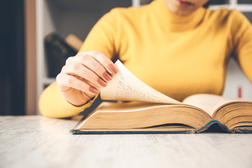 young sitting woman reading book