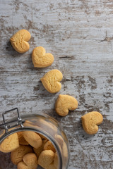 Fototapeta na wymiar Heart shaped cookies on light rustic background