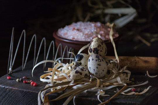 Decoration with qail eggs in nest. Breacfest prepearing process. Copy space. Farm style photo.