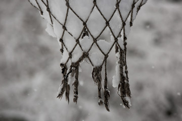 Basketball hoop net with snow. Winter basketball.