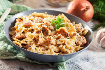 Creamy farfalle pasta with salmon, parmesan cheese and dill