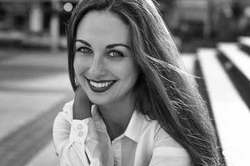 Portrait of sexy, smiling business woman. With lights effects and toning