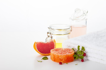 Handmade soap on a white background. Skin care product with the scent of grapefruit and wild berries. Spa treatments and aromatherapy for smooth and healthy skin.