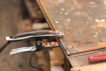 Work with welding in the carpentry shop. Weld metal parts. Dangerous industry