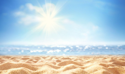 Plakat Summer background, nature of tropical golden beach with rays of sun light. Golden sand beach, sea water against blue sky with white clouds. Copy space, summer vacation concept.