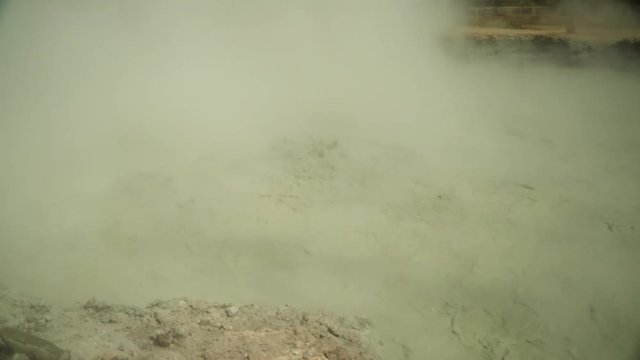 mud volcano Kawah Sikidang, geothermal activity and geysers. plateau Dieng with volcanic activity Indonesia. Famous tourist destination of Sikidang Crater it still generates thick sulfur fumes.