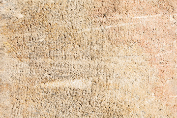 Closeup texture of plaster wall in sunny day