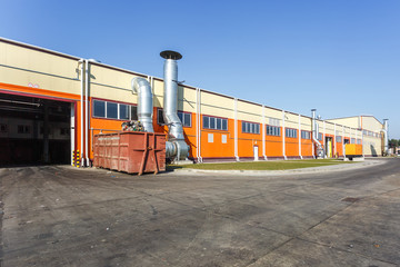 manufacture building of modern waste recycling processing plant in orange style. Separate garbage collection. Recycling and storage of waste for further disposal.