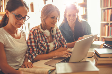 In the tranquil morning hours, a diligent group of female students assembles in the college library, gearing up for a productive day of focused studying and preparation.