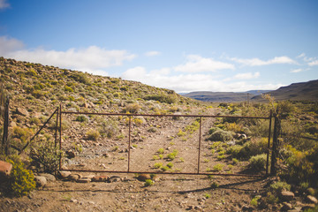 Fototapeta na wymiar Iconic scenes from the karoo region in South Africa, gravel roads and semi desert conditions